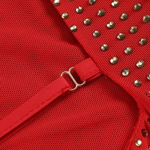Macro shot of red mesh fabric detailing with metallic hooks and round rivet accents