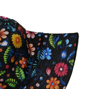 Detailed view of colorful floral pattern and neat stitching on a black sun bucket hat