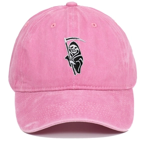 Close-up of Grim Reaper embroidery on pink washed cotton baseball cap with curved brim