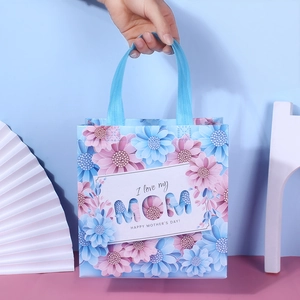Mother's Day floral gift bag with 'I love my MOM' print and blue sturdy handles