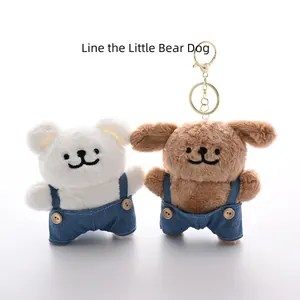 Plush puppy and bear charms wearing denim overalls with metal keychains on white background