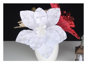 Close-up of white sequined poinsettia with red and gold glitter floral ornaments