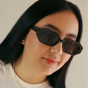 Fashionable polygon sunglasses with black geometric frame and dark grey lenses for women