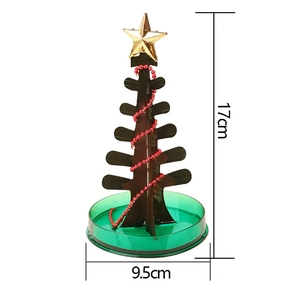 Magic colorful Christmas paper tree 17cm tall with green base and gold star topper