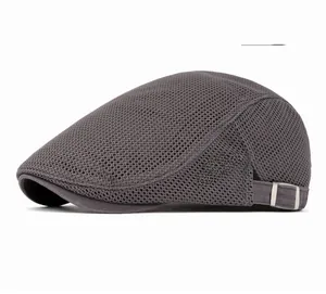 Detailed close-up of breathable grey mesh fabric and metal side buckle on the flat cap