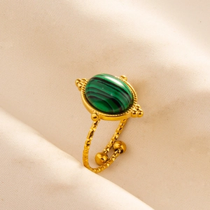 Detail of adjustable gold-finish stainless steel ring with a green malachite stone