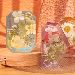 Octagon crystal resin lamp with dried flowers on a luminous wooden USB base