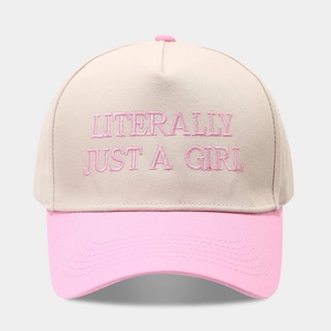 Detailed close-up of pink embroidery Literally Just A Girl on a cream baseball cap