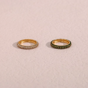 Chic gold multi-layer rings with shimmering white and emerald green cubic zirconia stones