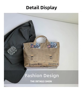 Detailed top view of a stylish newspaper print tote bag with brown handles on a white background