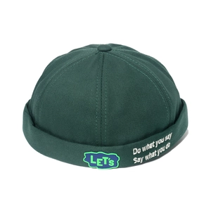 Dark green Docker cap with embroidered slogan and blue LET'S patch in street style