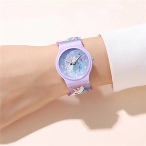 Detail of purple silicone strap with unicorn and rainbow pattern on kids watch