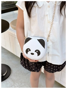 Girl wearing a panda-shaped PU leather crossbody bag with a stylish gold chain strap