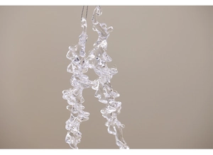 Macro shot of transparent acrylic icicle pendants with textured finish for Christmas decor