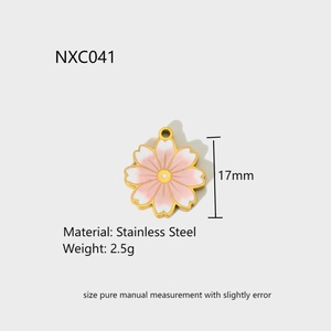 Detail view of 17mm pink cherry blossom pendant in gold plated stainless steel
