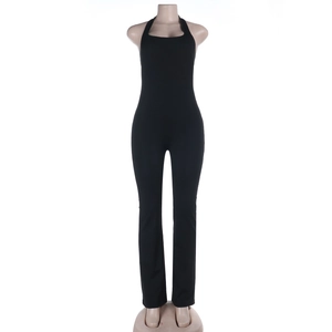 Close-up of black halter neck jumpsuit featuring a slim fit and flared leg design