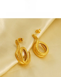 Macro shot of 18K gold plated snake earrings with detailed scale textures and eco-friendly plating