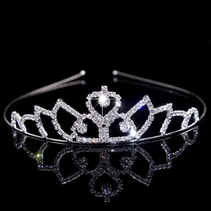Macro shot of sparkling rhinestones and silver metal claw chain on the crown detail