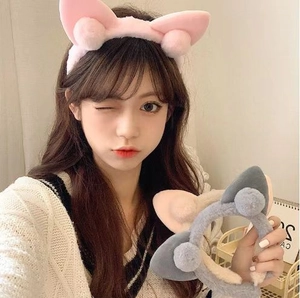 Cute plush cat ear headbands for women in pink and blue colors for daily skincare use