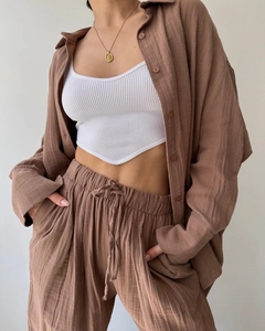Detail of brown linen shirt set with white ribbed tank top and drawstring wide-leg pants