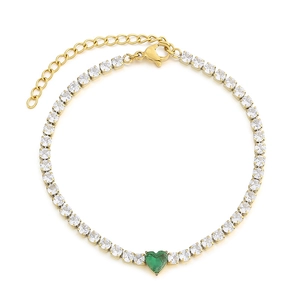Elegant gold-plated tennis bracelet with green heart-shaped stone and clear zircons