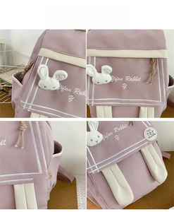 Detail of lavender backpack showing mifan rabbit embroidery and 3D plush bunny charm