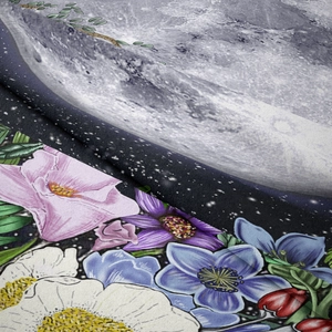 Close-up of bohemian tapestry showing moon phases and vibrant floral printing details