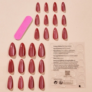 Sparkly cat eye stiletto press-on nails in reddish brown with nail file and adhesive glue