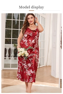 Detailed view of red floral satin nightgown featuring premium silk texture and lily print