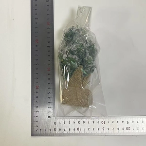 Detailed measurement of mini snow-flocked Christmas tree with rustic burlap base