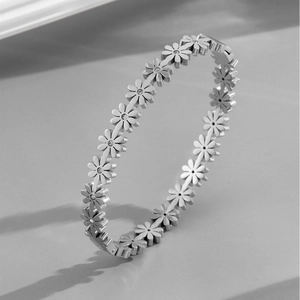 Silver daisy flower jewelry set with sparkling rhinestones in a modern 45-degree view