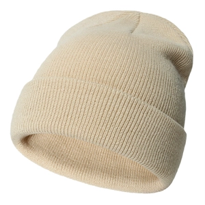 Beige ribbed knit beanie for infants and kids featuring a warm folded cuff design