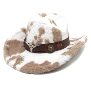 Detail of cow print cowboy hat featuring brown leather band and metal bull head emblem