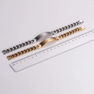 Polished gold and silver stainless steel Cuban link ID bracelets measuring 21.5cm long