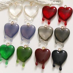 Set of ten colorful melting heart charms for DIY jewelry making in various translucent colors