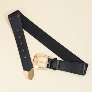 Women's black elastic corset belt with gold metal horseshoe buckle on a beige background