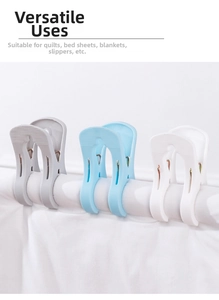Detail of large windproof plastic quilt clips in blue and white on thick bedding