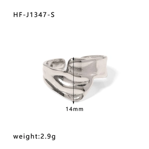 Macro shot of a minimalist silver wavy open ring with liquid metal texture and 14mm width