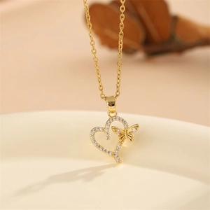 18K gold butterfly and heart pendant necklace with shimmering white zircon stones