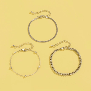 Three-piece silver snake and curb chain bracelet set with lobster clasp details
