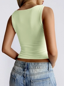 Detail view of light green sleeveless Y2K crop top back on a model with blue jeans
