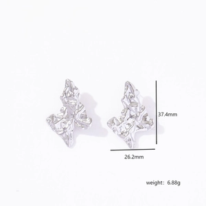 Macro shot of silver butterfly stud earrings with dimensions 37.4mm height and 26.2mm width