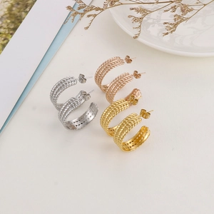 Three pairs of C-shaped twisted rope hoop earrings in gold, silver, and rose gold finish