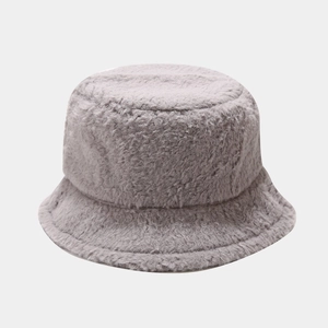 Close-up of thick plush gray faux fur texture on warm winter bucket hat for women