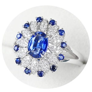 Luxurious silver ring featuring a 2-carat oval blue sapphire with diamond flower halo