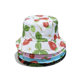 Cute strawberry print bucket hats for women in white, pink, blue and black cotton fabric
