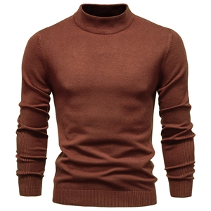 Close-up of ribbed cuffs and collar on a thick dark brick red knitted men's sweater