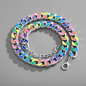 Close-up of silver Cuban link necklace with colorful rainbow enamel and lobster clasp