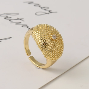 Hip hop gold plated open ring with textured bead dome and sparkling cubic zirconia stone