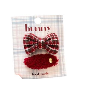 Red plaid bow and plush hair clip set for girls with gold rhinestone on card